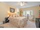 Bedroom with a ceiling fan, bay window, and a reading nook with chairs and lamps at 3192 Paces Mill Se Rd, Atlanta, GA 30339
