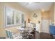 Eat-in kitchen featuring hardwood floors, modern light fixtures and an adjacent sitting area at 3192 Paces Mill Se Rd, Atlanta, GA 30339