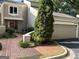 Charming home featuring a red front door, brick pathway, a 2 car garage, and mature landscaping at 3192 Paces Mill Se Rd, Atlanta, GA 30339
