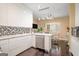 Modern kitchen featuring stainless steel appliances, sleek cabinetry, hardwood floors, and bright lighting at 3192 Paces Mill Se Rd, Atlanta, GA 30339