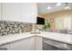 Modern kitchen features white cabinets, stainless steel appliances, and quartz countertops at 3192 Paces Mill Se Rd, Atlanta, GA 30339