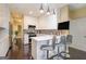 Modern kitchen featuring stainless steel appliances, sleek cabinetry, hardwood floors, and bright lighting at 3192 Paces Mill Se Rd, Atlanta, GA 30339