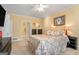 Main bedroom with a doorway leading to a bathroom, large dresser, and stylish décor at 3192 Paces Mill Se Rd, Atlanta, GA 30339