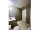 Bathroom with a single sink vanity, toilet, and white door at 3838 Kirkwood Nw Run, Kennesaw, GA 30144