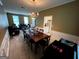 Open floor plan featuring a dining room and living spaces with ample natural light at 3838 Kirkwood Nw Run, Kennesaw, GA 30144
