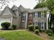 Charming two-story home showcasing neutral siding and complementary black shutters at 3838 Kirkwood Nw Run, Kennesaw, GA 30144