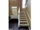 Bright foyer showcases a carpeted staircase and door with sidelights for ample light at 3838 Kirkwood Nw Run, Kennesaw, GA 30144