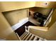 Elevated view down carpeted stairs into foyer and living room with hardwood floors at 3838 Kirkwood Nw Run, Kennesaw, GA 30144