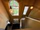Bright foyer has high ceilings and decorative lighting with view of front door at 3838 Kirkwood Nw Run, Kennesaw, GA 30144