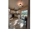 Bright kitchen features stainless steel appliances and a sliding glass door to the backyard at 3838 Kirkwood Nw Run, Kennesaw, GA 30144