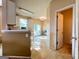 Bright kitchen with white cabinetry and a sliding glass door to a patio at 3838 Kirkwood Nw Run, Kennesaw, GA 30144