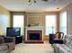 Bright living room featuring a brick fireplace and natural light at 3838 Kirkwood Nw Run, Kennesaw, GA 30144