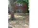 Brick house with window units visible from the backyard at 603 New Hope Rd, Fayetteville, GA 30214