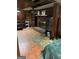 A basement with a brick fireplace, wood paneling, and tile flooring at 603 New Hope Rd, Fayetteville, GA 30214