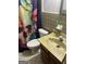 Retro bathroom with a colorful butterfly-themed shower curtain and vintage fixtures at 603 New Hope Rd, Fayetteville, GA 30214