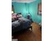 Bedroom with hardwood floors and a window letting in natural light at 603 New Hope Rd, Fayetteville, GA 30214