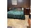 Bedroom with a bed, wood paneling, and a dresser at 603 New Hope Rd, Fayetteville, GA 30214
