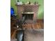 Living room featuring a brick fireplace and original hardwood floors at 603 New Hope Rd, Fayetteville, GA 30214