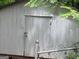 Metal outbuilding with a chained fence at 603 New Hope Rd, Fayetteville, GA 30214