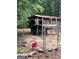 Rustic outbuilding with fencing and animal feeding supplies at 603 New Hope Rd, Fayetteville, GA 30214