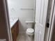 Bathroom area with a marble countertop vanity and nearby toilet at 6190 Douglas Manor Ct, Douglasville, GA 30134