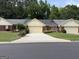 Attractive brick and siding home with a well-kept lawn and a paved driveway at 6190 Douglas Manor Ct, Douglasville, GA 30134