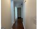 Hallway with wood floors leads to storage closet at 6190 Douglas Manor Ct, Douglasville, GA 30134