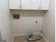 Interior laundry room features tile floor and cabinet storage at 6190 Douglas Manor Ct, Douglasville, GA 30134