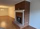 Living room with fireplace, mantle, hardwood floors and neutral paint at 6190 Douglas Manor Ct, Douglasville, GA 30134