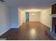Open floor plan with hardwood floors, white walls, fireplace, and neutral paint at 6190 Douglas Manor Ct, Douglasville, GA 30134
