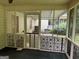 Enclosed screened porch with decorative railing, offering a cozy outdoor space at 6190 Douglas Manor Ct, Douglasville, GA 30134