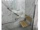 Accessible marble shower featuring grab bars and built-in seating at 6190 Douglas Manor Ct, Douglasville, GA 30134