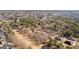 An aerial view of a home and its surrounding community, showcasing the tranquil wooded setting and lush landscape at 1585 Lake Dow Rd, Mcdonough, GA 30252