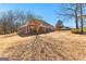A shot of the exterior and spacious backyard of a brick home at 1585 Lake Dow Rd, Mcdonough, GA 30252