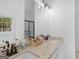 Bright bathroom featuring double sinks, granite countertops, and a seamless glass shower at 1585 Lake Dow Rd, Mcdonough, GA 30252