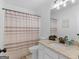 Bathroom featuring granite countertop vanity, matching framed mirror and shower at 1585 Lake Dow Rd, Mcdonough, GA 30252