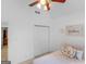 Light-filled bedroom featuring a ceiling fan, closet with bifold doors and neutral carpet at 1585 Lake Dow Rd, Mcdonough, GA 30252