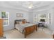 Spacious bedroom featuring a bed, windows providing natural light, and small workstation at 1585 Lake Dow Rd, Mcdonough, GA 30252