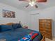 Cozy bedroom features a comfortable bed, closet, and classic wood dresser at 1585 Lake Dow Rd, Mcdonough, GA 30252