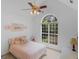 Bright bedroom with vaulted ceiling, large arched window and light pink accents at 1585 Lake Dow Rd, Mcdonough, GA 30252