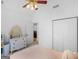Bedroom featuring closet, white dresser and doorway leading to kitchen area at 1585 Lake Dow Rd, Mcdonough, GA 30252