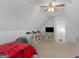 Attic bedroom featuring a twin bed, sloped ceilings, a ceiling fan, and a TV at 1585 Lake Dow Rd, Mcdonough, GA 30252