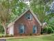 Beautiful brick home featuring a side-entry garage, well-kept lawn, and manicured landscaping at 1585 Lake Dow Rd, Mcdonough, GA 30252