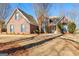 Charming brick home with a well-manicured front lawn and beautiful landscaping at 1585 Lake Dow Rd, Mcdonough, GA 30252