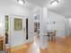 Inviting foyer featuring gleaming hardwood floors, a stylish front door, and natural light, showcasing a warm entrance at 1585 Lake Dow Rd, Mcdonough, GA 30252