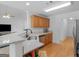 Modern kitchen with granite countertops, stainless steel appliances, and wood floors at 1585 Lake Dow Rd, Mcdonough, GA 30252