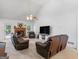 Vaulted living room with a cozy fireplace and comfortable furniture at 1585 Lake Dow Rd, Mcdonough, GA 30252