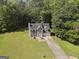 Aerial view of two-story home with a spacious yard and surrounding trees at 96 Ashtonbrook Dr, Mcdonough, GA 30252