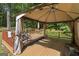 Inviting outdoor deck covered with a gazebo, perfect for relaxation and entertaining friends and Gathering at 96 Ashtonbrook Dr, Mcdonough, GA 30252