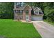Two-story brick home featuring blue shutters, attached two-car garage and well-maintained lawn at 96 Ashtonbrook Dr, Mcdonough, GA 30252